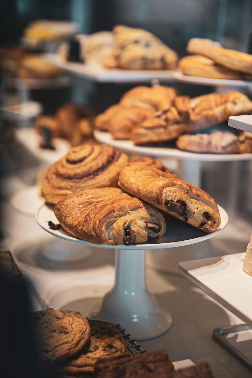 chocolate croissants on a stand