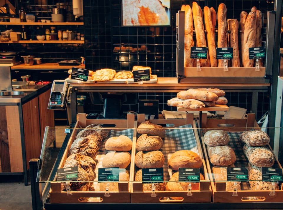 breads in glass case at bakery